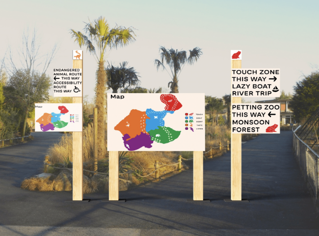 Signage at a crossroads with the main map for route 1 of the zoo and the endangered animal route of the zoo.