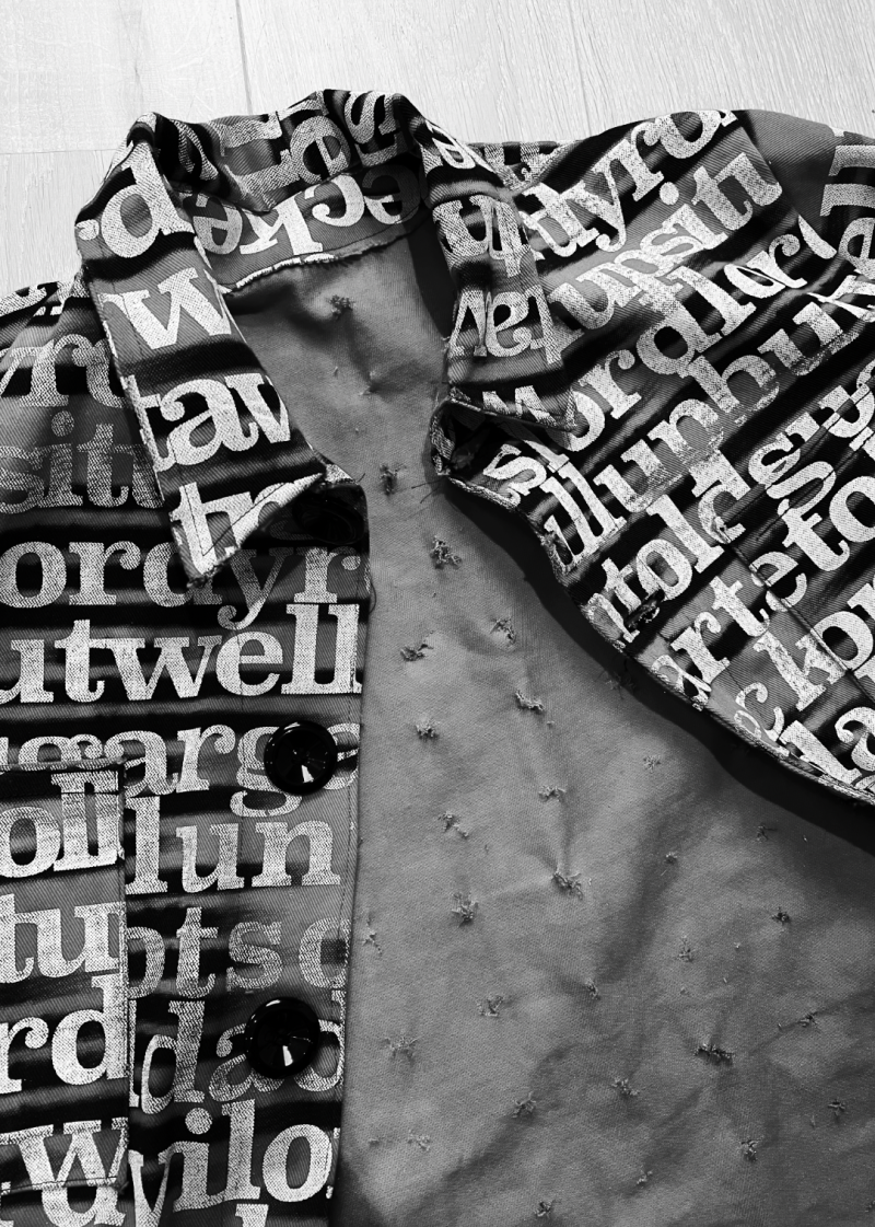 ‘When I Rise’ is a visual interpretation of the music piece “Early in the Mornin’” by Alan Lomax. The musics data has been transformed into a screen-print on fabric, crafted into a work-wear jacket. The images represent the sound of the lyrics, not their literal content, with a distorted black layer obscuring the actual words.